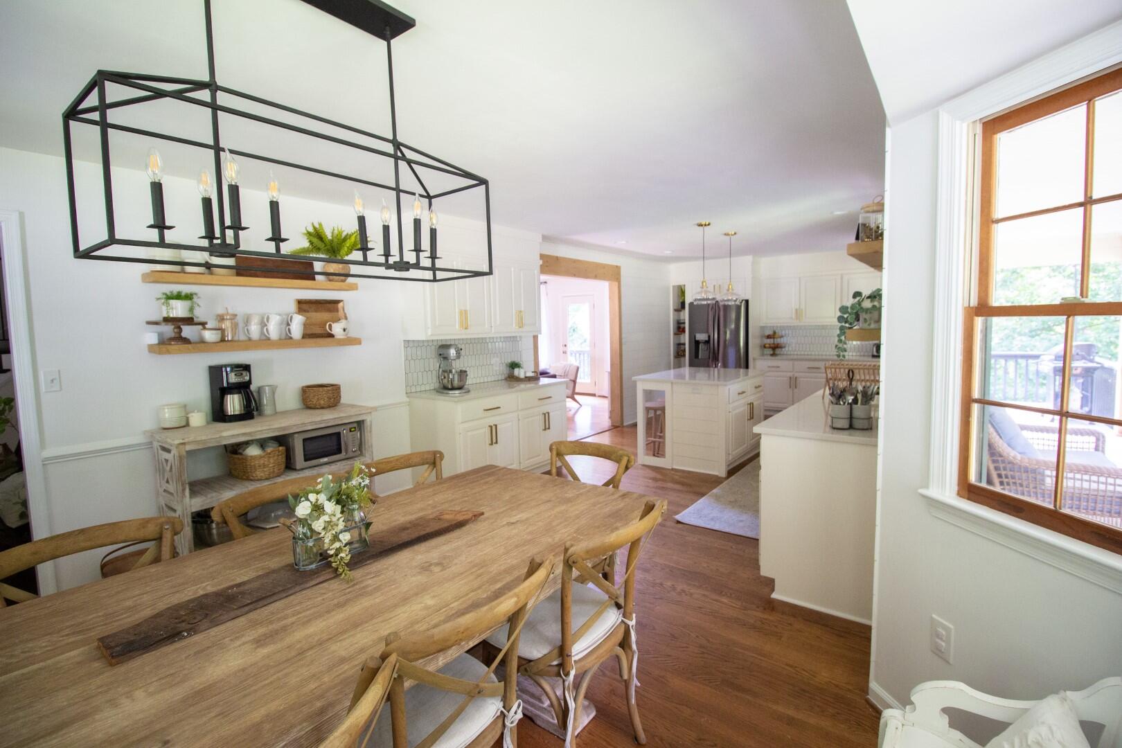 2420 Roaring Run Road Goode, VA 24556 - Photo 51 of 53 a kitchen with stainless steel appliances wooden floor dining table and chairs