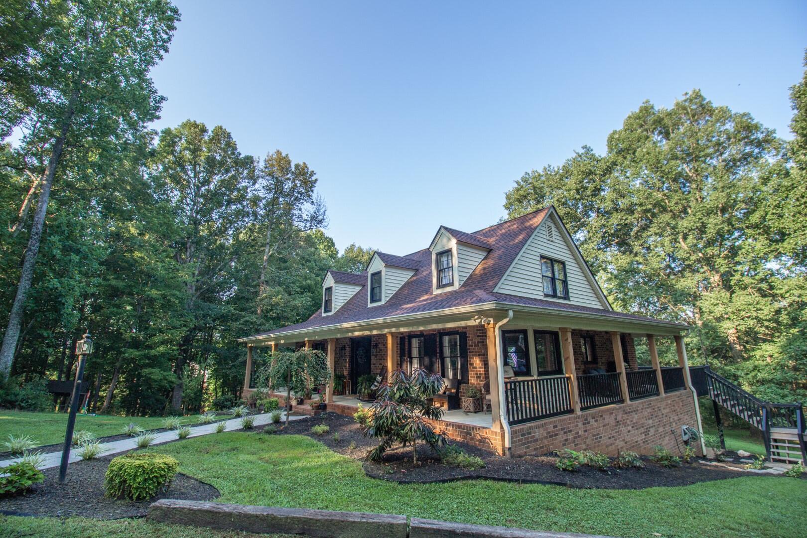2420 Roaring Run Road Goode, VA 24556 - Photo 52 of 53 a front view of a house with garden