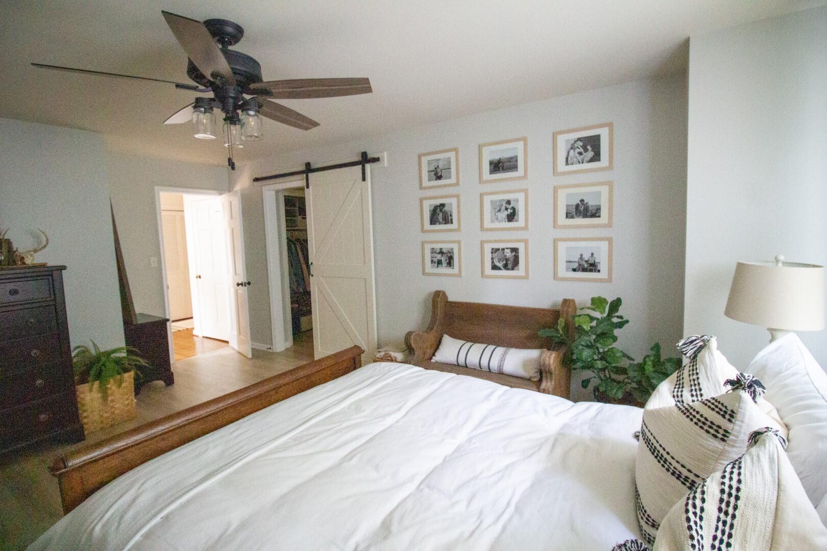 2420 Roaring Run Road Goode, VA 24556 - Photo 8 of 53 a bedroom with a bed and a chandelier