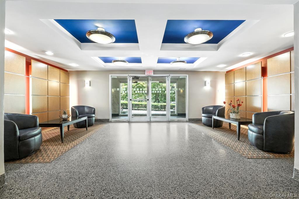 1133 Midland Avenue, Unit 3D Bronxville, NY 10708 - Photo 16 of 20 a living room with furniture and large windows
