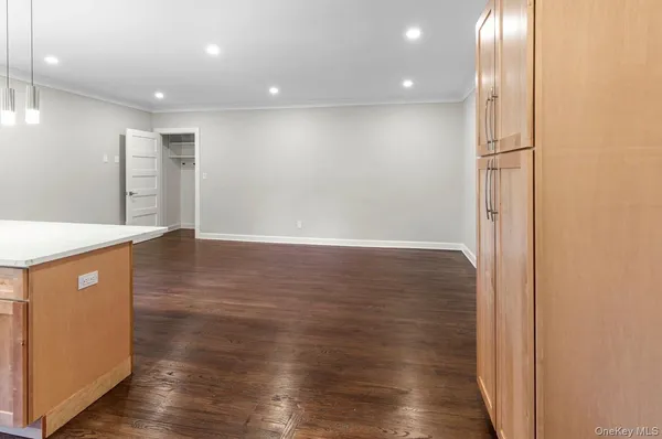 an empty room with wooden floor