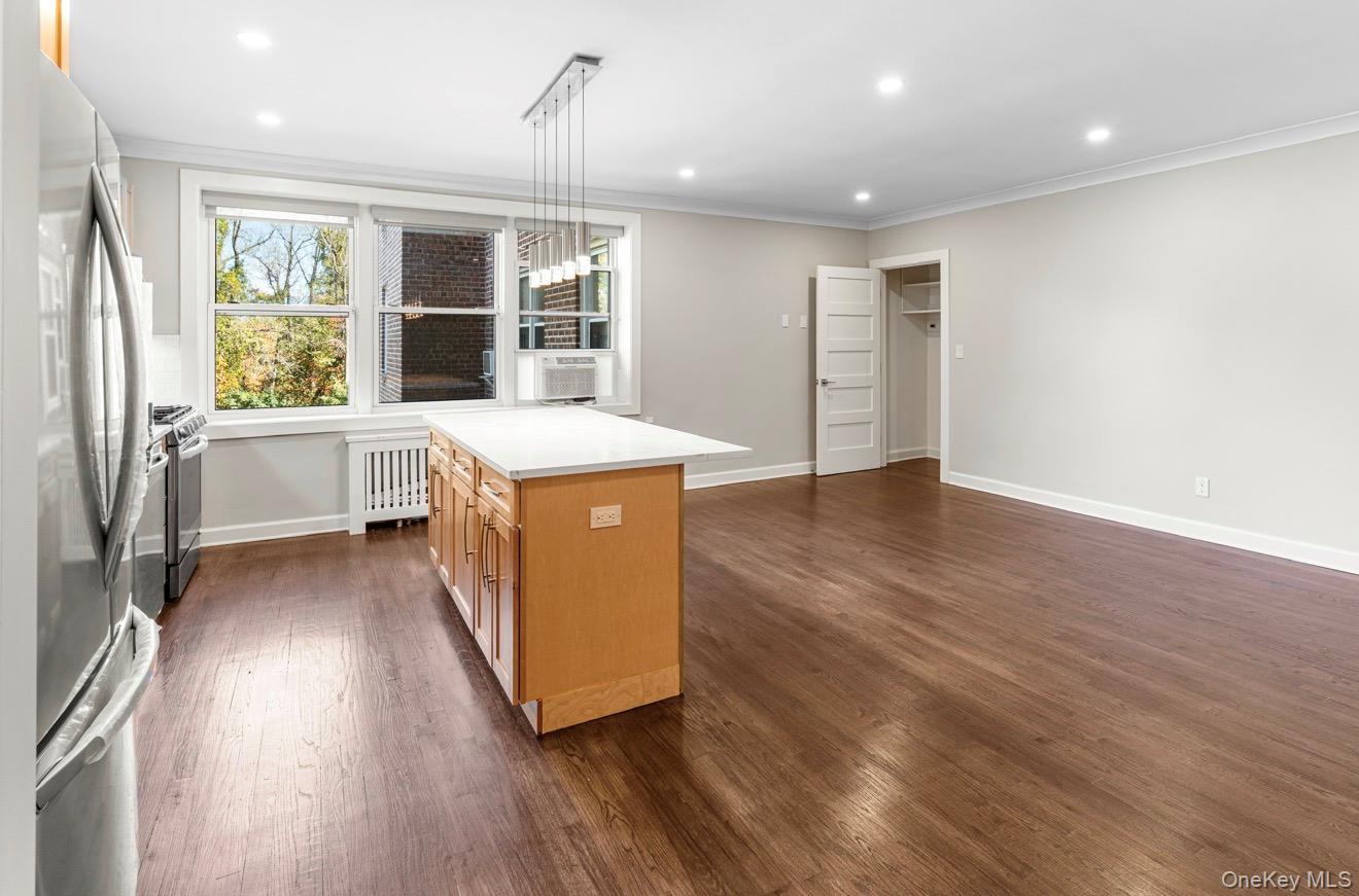 1133 Midland Avenue, Unit 3D Bronxville, NY 10708 - Photo 8 of 20 a view of a kitchen with wooden floor and electronic appliances