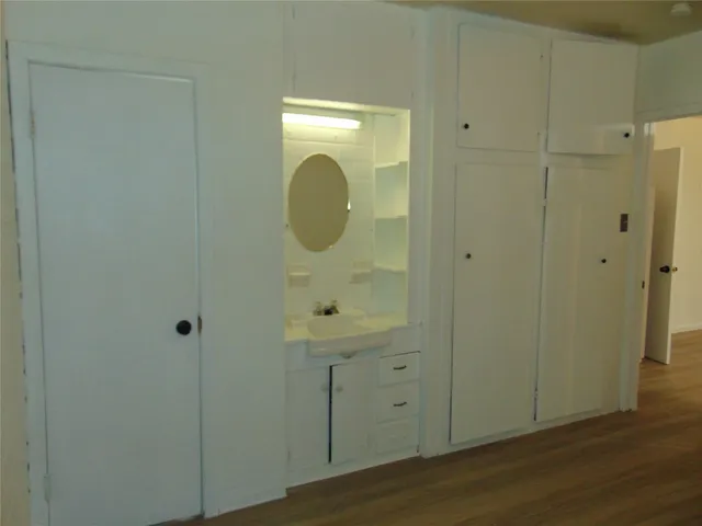 a bathroom with a sink and mirror