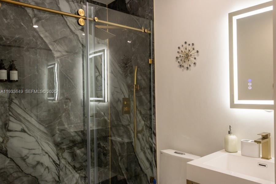 765 Northwest 77th Street Miami, FL 33150 - Photo 10 of 23 a bathroom with a bathtub and shower