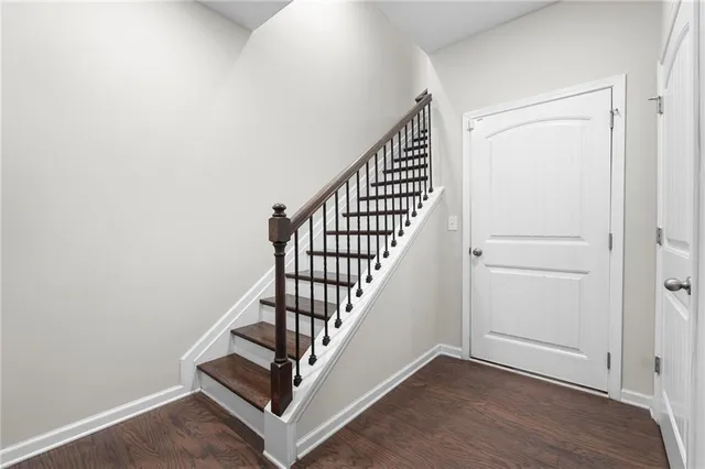 an entryway with wooden floor