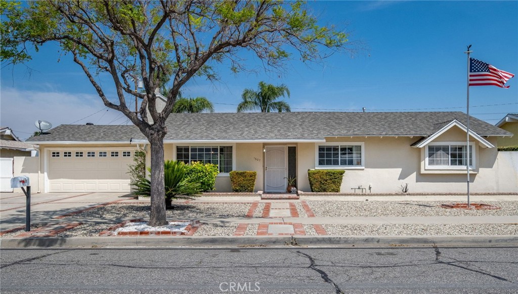 1607 Blackwall Drive Simi Valley, CA 93063 - Photo 1 of 47 a front view of a house with a yard and potted plants