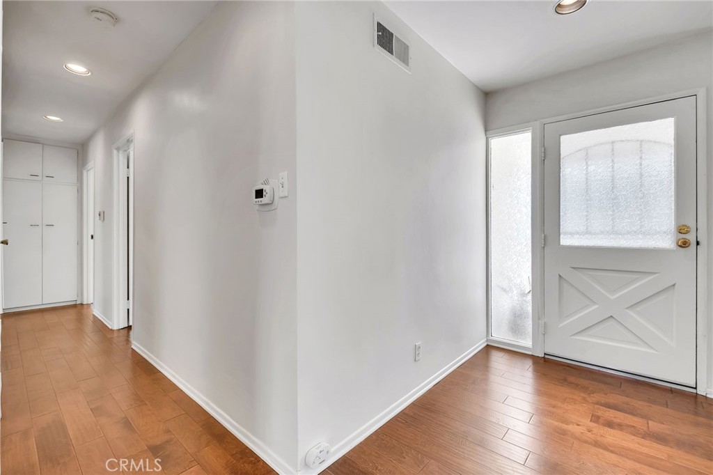 1607 Blackwall Drive Simi Valley, CA 93063 - Photo 17 of 47 a view of an empty room with wooden floor