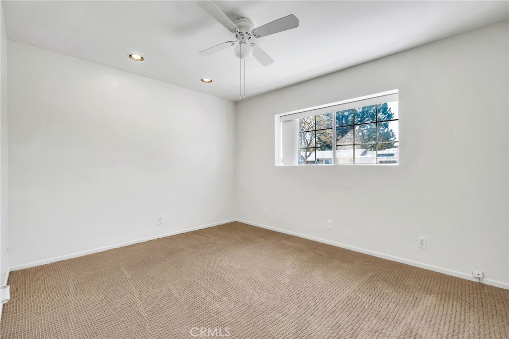 1607 Blackwall Drive Simi Valley, CA 93063 - Photo 25 of 47 an empty room with a window and a ceiling fan