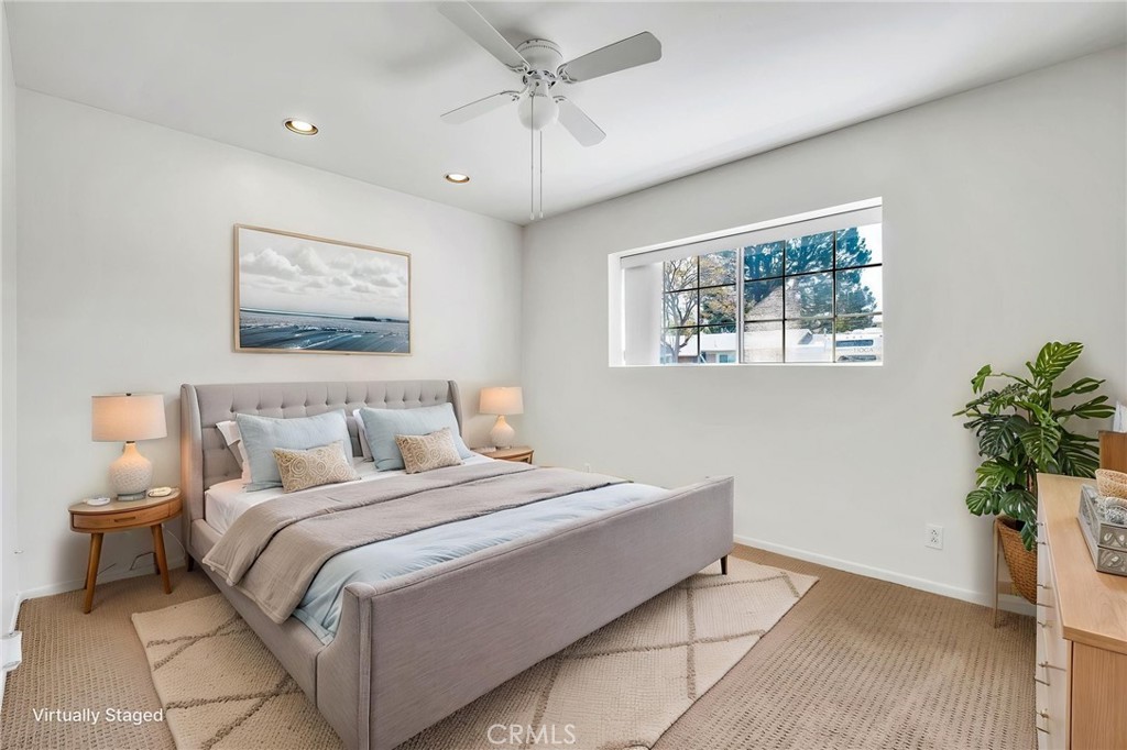 1607 Blackwall Drive Simi Valley, CA 93063 - Photo 26 of 47 a bedroom with a large bed and a potted plant
