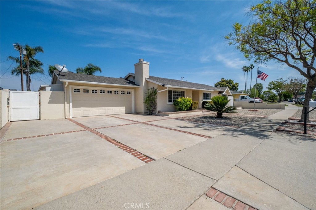 1607 Blackwall Drive Simi Valley, CA 93063 - Photo 39 of 47 a view of a house with a backyard and a garage