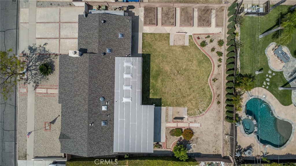 1607 Blackwall Drive Simi Valley, CA 93063 - Photo 43 of 47 an aerial view of a residential apartment building with a yard and parking space
