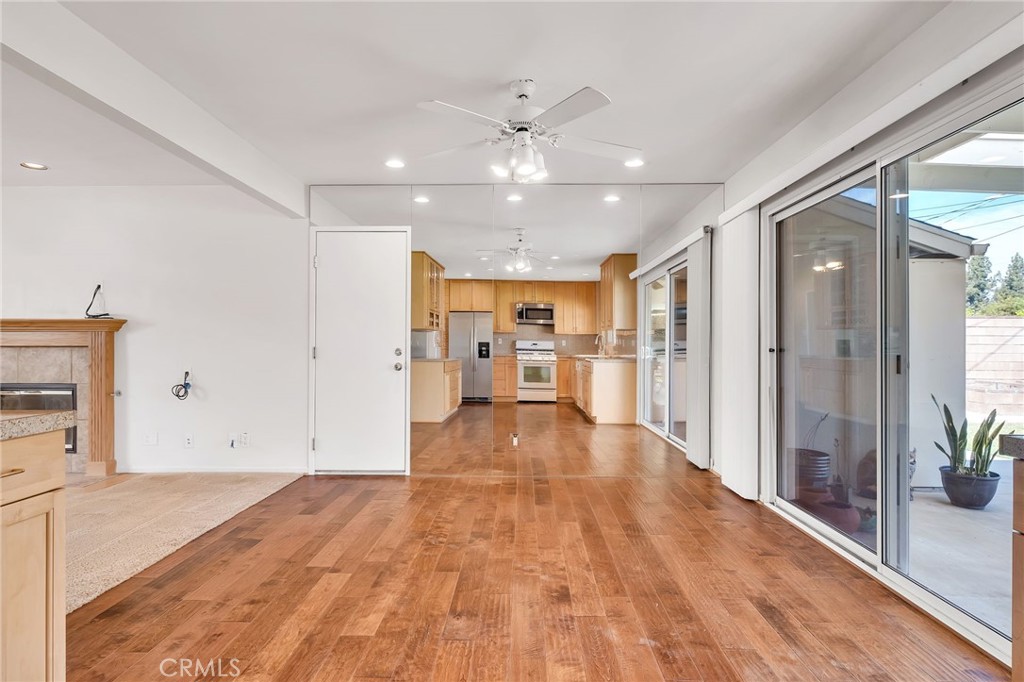 1607 Blackwall Drive Simi Valley, CA 93063 - Photo 5 of 47 a view of a kitchen with refrigerator and wooden floor