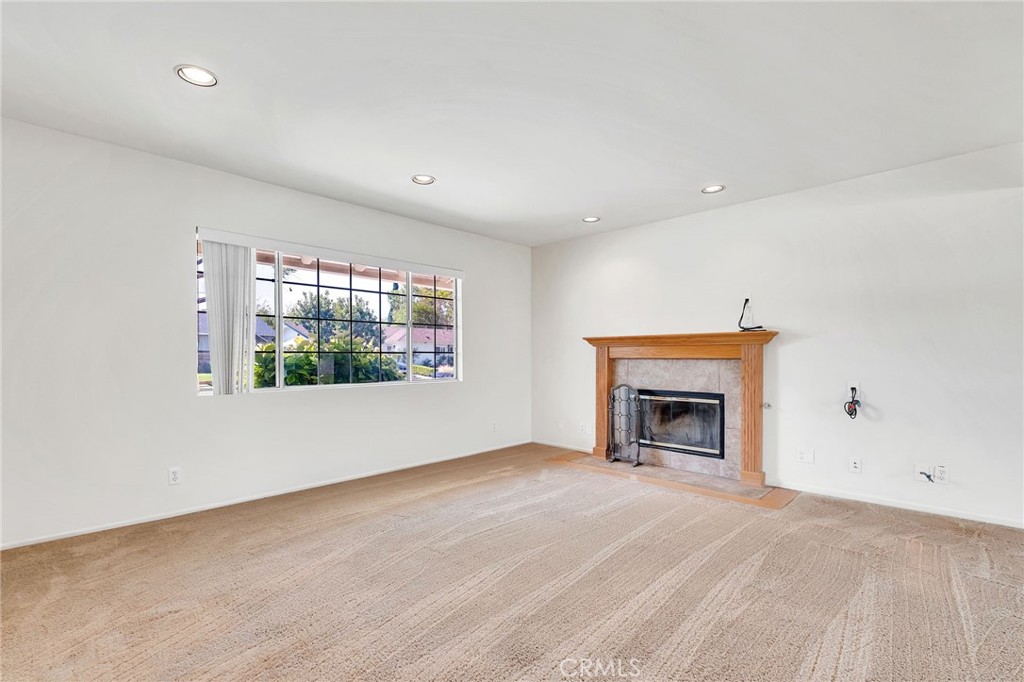 1607 Blackwall Drive Simi Valley, CA 93063 - Photo 6 of 47 an empty room with windows and fireplace