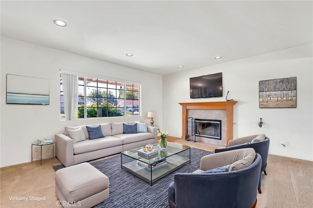 1607 Blackwall Drive Simi Valley, CA 93063 - Photo 7 of 47 a living room with furniture a fireplace and a flat screen tv