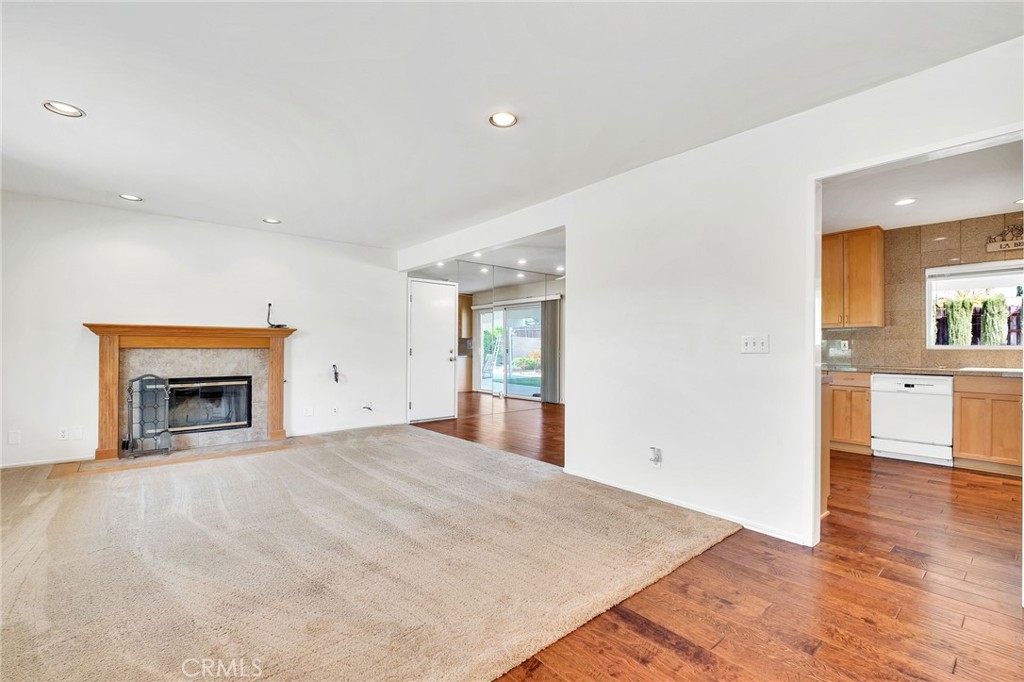 1607 Blackwall Drive Simi Valley, CA 93063 - Photo 8 of 47 a view of an empty room with a fireplace and a window
