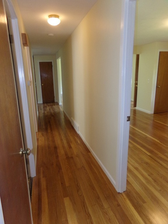 179 Birch Road Longmeadow, MA 01106 - Photo 17 of 23 a view of a hallway with wooden floor