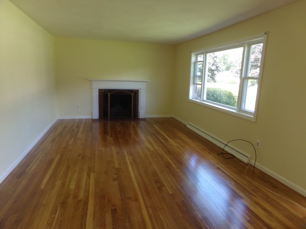 179 Birch Road Longmeadow, MA 01106 - Photo 8 of 23 a view of an empty room with wooden floor and a window