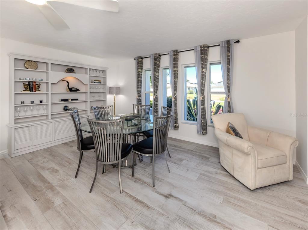 1232 Pine Needle Road Venice, FL 34285 - Photo 24 of 91 a view of a dining room with furniture and window