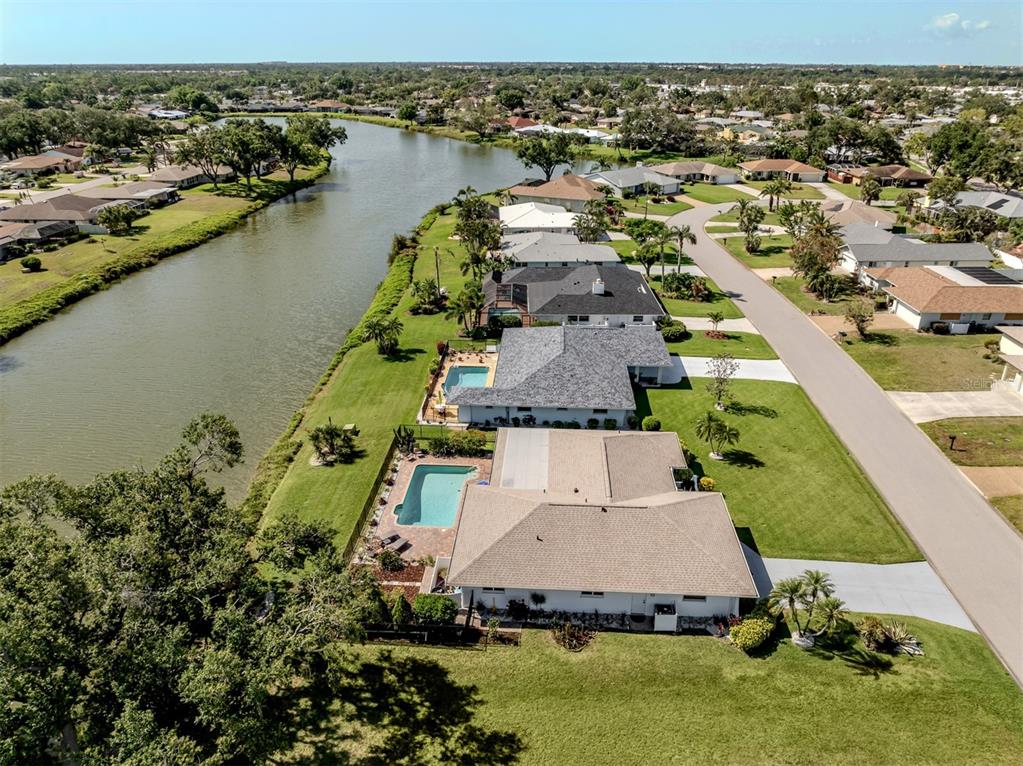 1232 Pine Needle Road Venice, FL 34285 - Photo 44 of 91 an aerial view of a house with a lake view