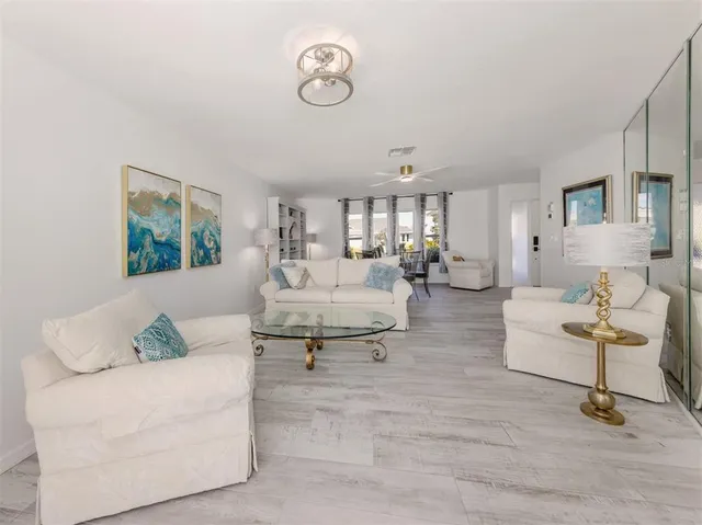 a bedroom with a bed and a flat tv screen on wall