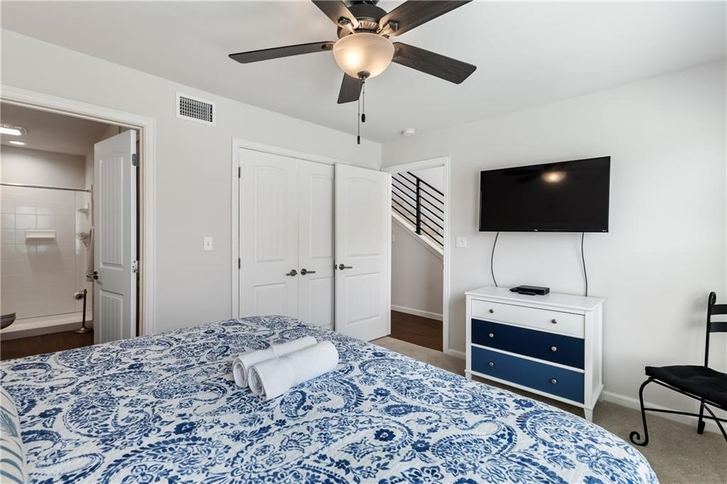 620 Fulton Beach Road, Unit 308 Rockport, TX 78382 - Photo 13 of 30 a bedroom with a bed and a flat screen tv