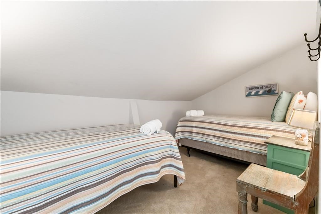 620 Fulton Beach Road, Unit 308 Rockport, TX 78382 - Photo 17 of 30 a bedroom with a bed and a cabinets