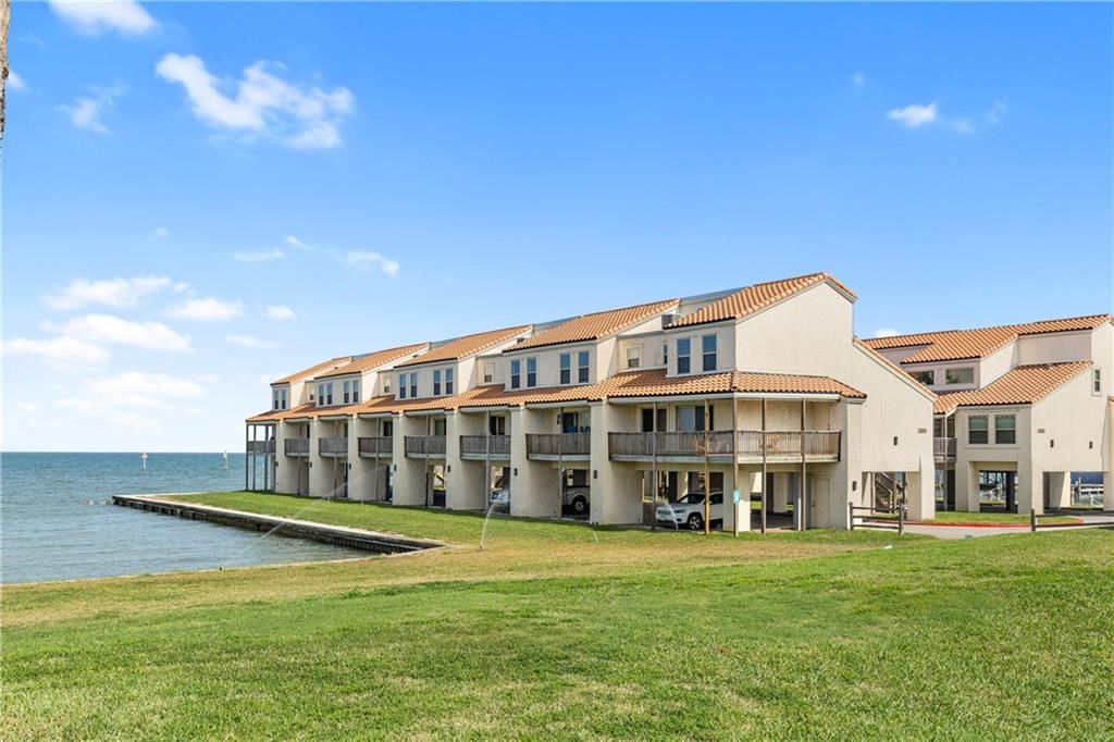 620 Fulton Beach Road, Unit 308 Rockport, TX 78382 - Photo 30 of 30 a view of a house with a big yard