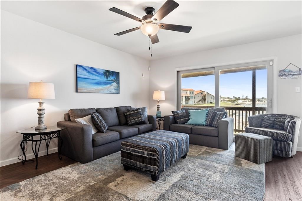 620 Fulton Beach Road, Unit 308 Rockport, TX 78382 - Photo 3 of 30 a living room with furniture and a large window