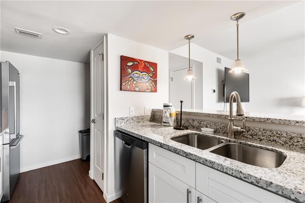 620 Fulton Beach Road, Unit 308 Rockport, TX 78382 - Photo 9 of 30 a kitchen with a sink a refrigerator and window