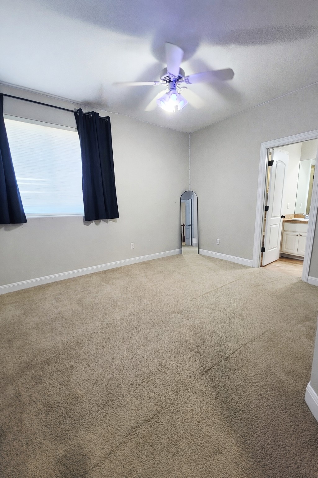 152 Silver Hawk Court Dripping Springs, TX 78620 - Photo 20 of 31 a view of a livingroom with a ceiling fan and window