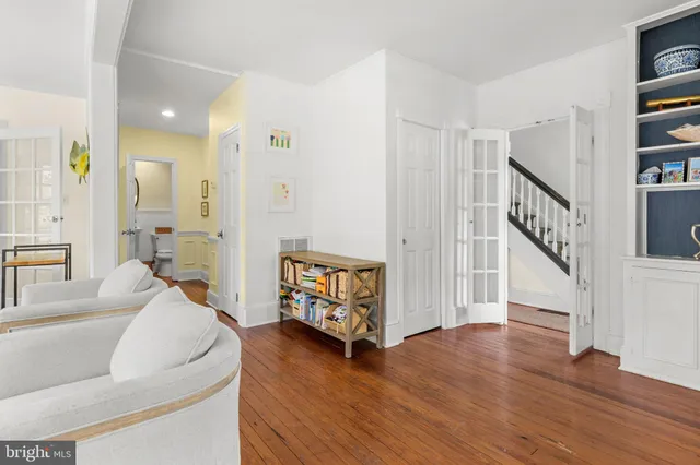 a kitchen with stainless steel appliances granite countertop a refrigerator a sink a stove and a refrigerator