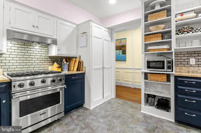 a view of a bedroom with furniture and windows