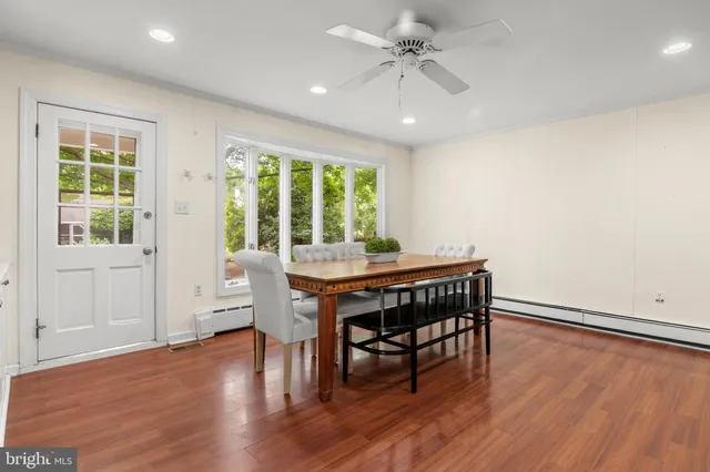 a bathroom with a shower curtain and a window