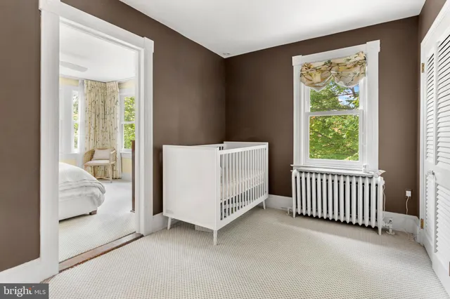 a view of a house with backyard porch and sitting area