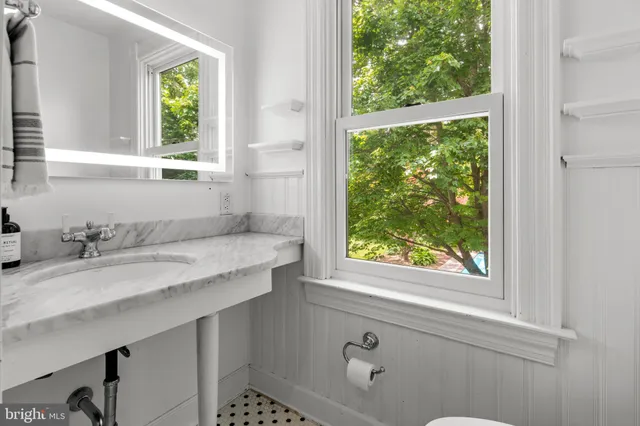 a view of a chairs and backyard with a small yard