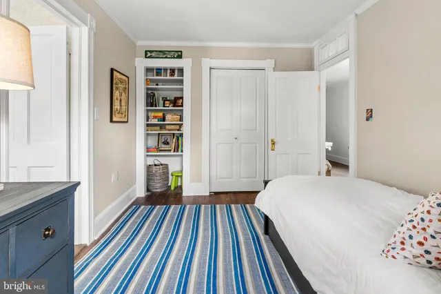 a front view of a house with a yard table and chairs