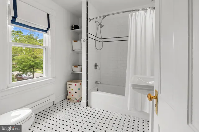 a wooden house with trees in front of it