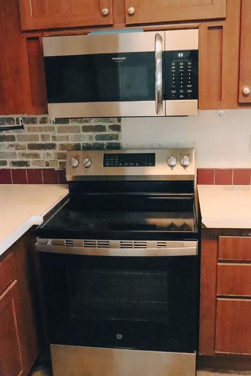 448 Fernandez Street Winter Haven, FL 33880 - Photo 15 of 27 a stove top oven sitting inside of a kitchen