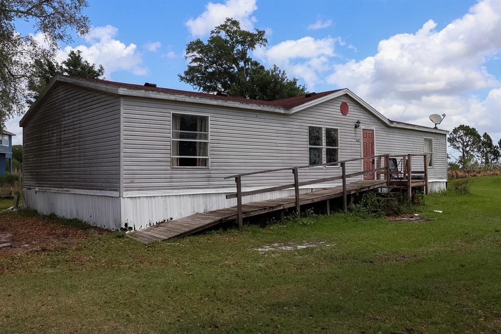 448 Fernandez Street Winter Haven, FL 33880 - Photo 19 of 27 a view of a house with a backyard