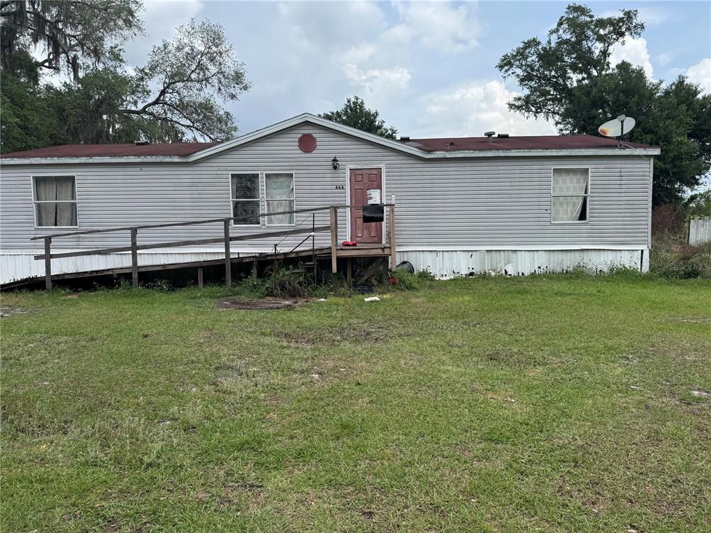 448 Fernandez Street Winter Haven, FL 33880 - Photo 21 of 27 a view of a house with a backyard
