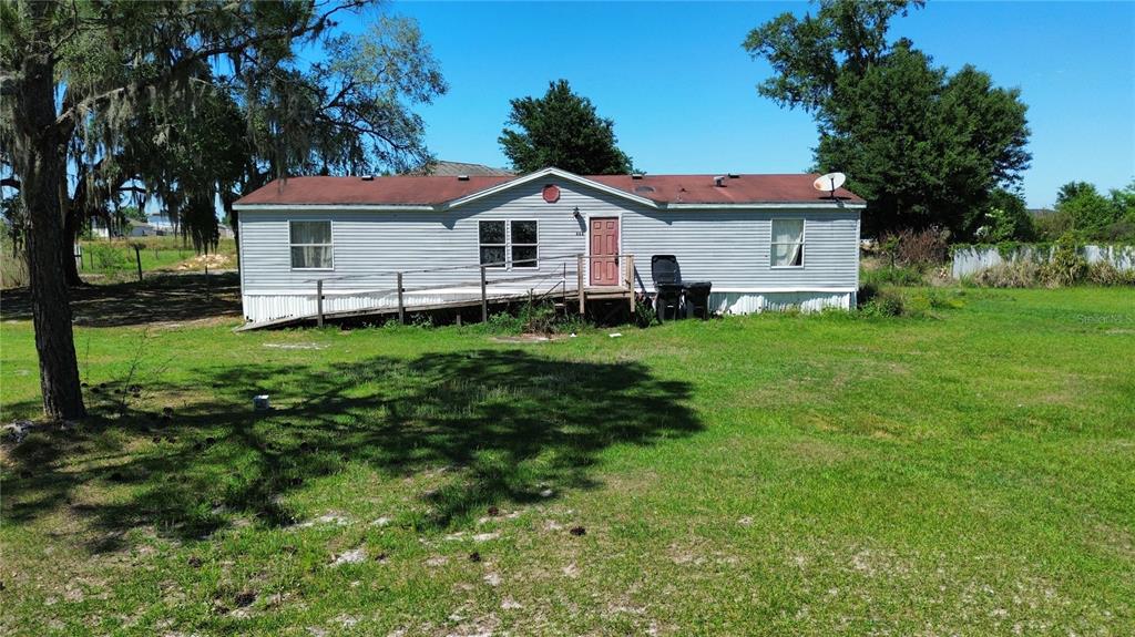 448 Fernandez Street Winter Haven, FL 33880 - Photo 27 of 27 a front view of a house with a garden