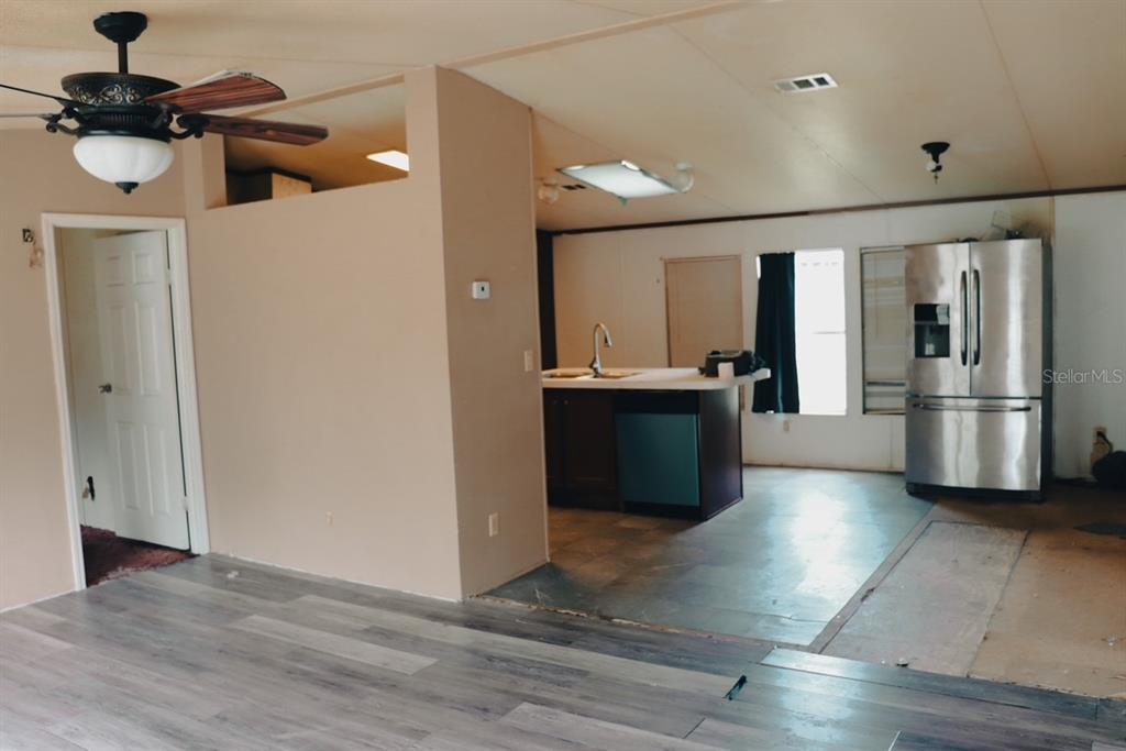 448 Fernandez Street Winter Haven, FL 33880 - Photo 10 of 27 a view of a kitchen with a sink and refrigerator