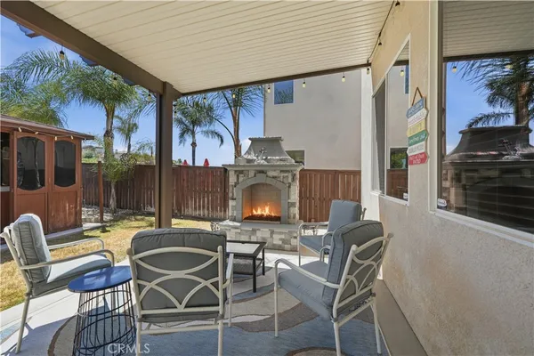 a view of a house with a backyard and balcony