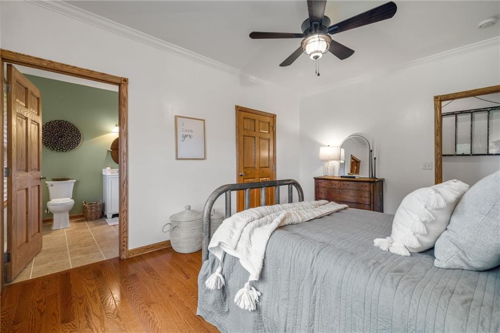 764 Old Millcreek Road Hookstown, PA 15050 - Photo 19 of 48 a bedroom with a bed mirror and window