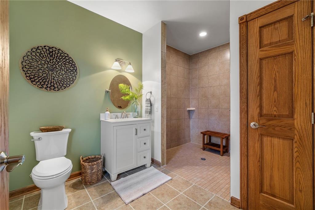 764 Old Millcreek Road Hookstown, PA 15050 - Photo 20 of 48 a bathroom with a toilet a sink and mirror