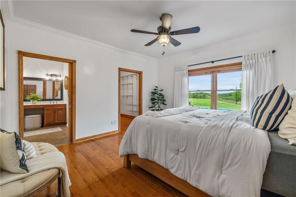 764 Old Millcreek Road Hookstown, PA 15050 - Photo 23 of 48 a bedroom with a bed and a chandelier