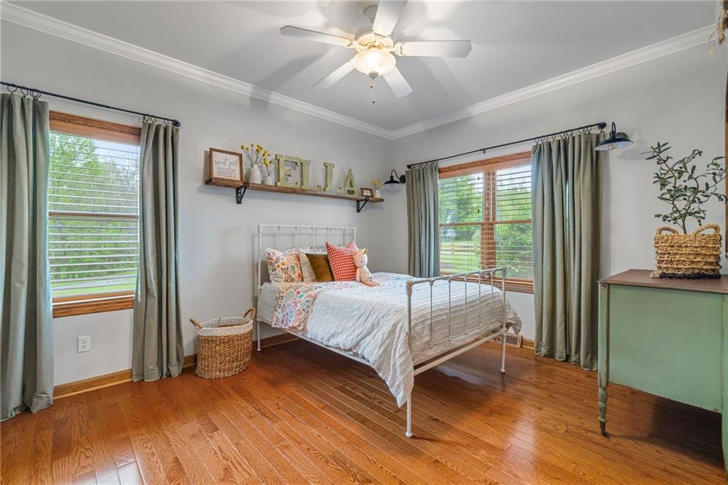764 Old Millcreek Road Hookstown, PA 15050 - Photo 26 of 48 a bedroom with a bed and a chandelier