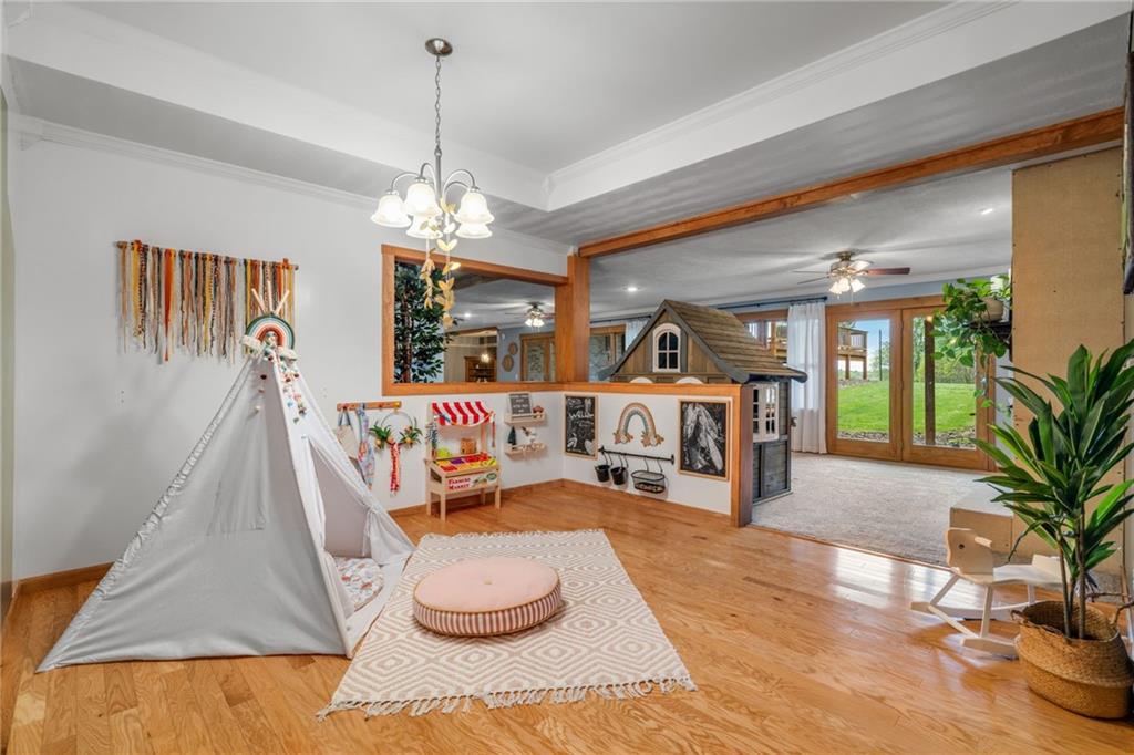 764 Old Millcreek Road Hookstown, PA 15050 - Photo 32 of 48 a living room with furniture and a chandelier
