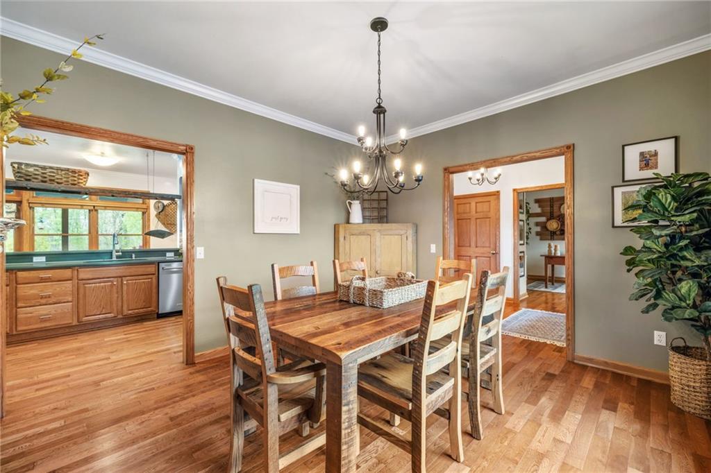 764 Old Millcreek Road Hookstown, PA 15050 - Photo 7 of 48 a dining room with furniture wooden floor and a chandelier