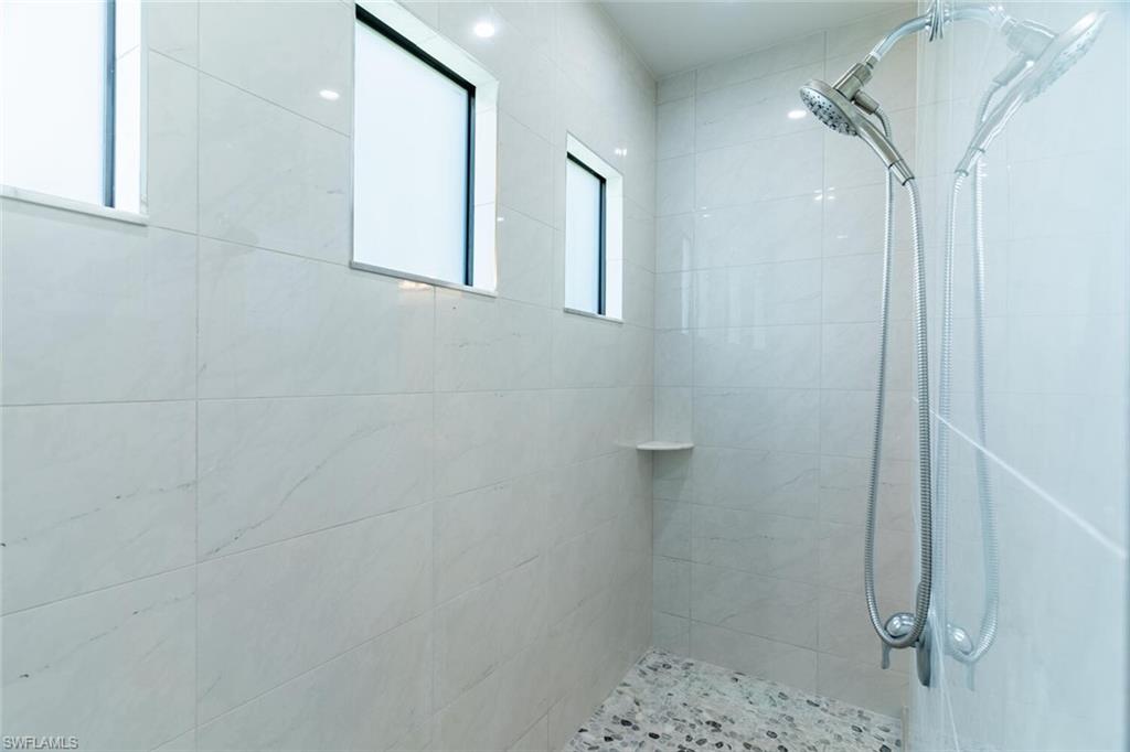 2572 Randall Boulevard Naples, FL 34120 - Photo 26 of 45 a bathroom with a shower